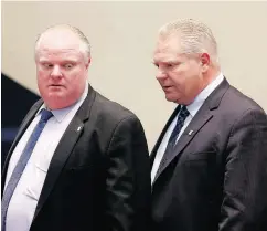  ?? MICHAEL PEAKE / POSTMEDIA NEWS FILES ?? PC Leader Doug Ford, right, flanked by late brother Rob, writes in his recent book that mayors of all political stripes have been thwarted by Toronto councillor­s.