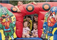  ?? ANDY JACKSON/STUFF ?? Enjoying the bouncy castle at the Waitara Waitangi Day market are, front, Charlie Johnson, 3, and Lettie Johnson, 3. Behind are Patrick Tahu, 8, and Awhina Johnson, 11. Top is Jayden Johnson, 9.