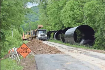  ?? Blake Silvers ?? Repairs to Dobson Road are underway. The road has been closed since late March after flood damage from heavy rains across the area.