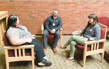  ?? HANNAH FINGERHUT/AP ?? Eric Johnson, center, director of spiritual care at UnityPoint Health’s hospitals in the Des Moines, Iowa, area, speaks March 11 with other chaplains under his direction. Some conservati­ves want to place chaplains in public schools.