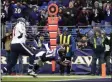  ?? NICK WASS - THE ASSOCIATED PRESS ?? Baltimore Ravens running back Mark Ingram (21) dives in for a touchdown on a pass from quarterbac­k Lamar Jackson, not visible, during the second half of an NFL football game against the Houston Texans, Sunday, Nov. 17, 2019, in Baltimore.