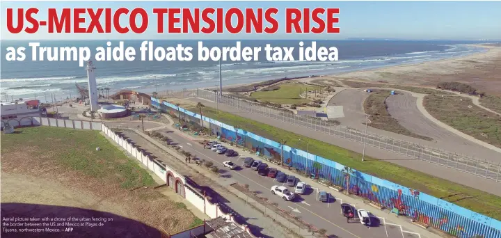  ?? — AFP ?? Aerial picture taken with a drone of the urban fencing on the border between the US and Mexico at Playas de Tijuana, northweste­rn Mexico.