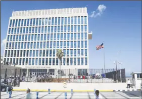  ?? AP PHOTO ?? A U.S. flag flies at the U.S. embassy in Havana, Cuba. Senior U.S. officials say the United States is pulling roughly 60 per cent of its staff out of Cuba and warning American travellers not to visit due to “specific attacks” that have harmed U.S....