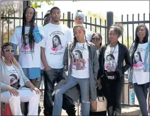  ??  ?? Latifah Wilson, left, the sister of Nia Wilson, and family members wait outside KTVU in Oakland on Thursday, protesting the station’s use of a photo of Nia Wilson holding a cellphone that looked like a gun.