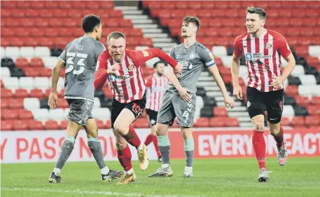  ??  ?? Aiden O’Brien celebrates Sunderland’s opening goal with Charlie Wyke.