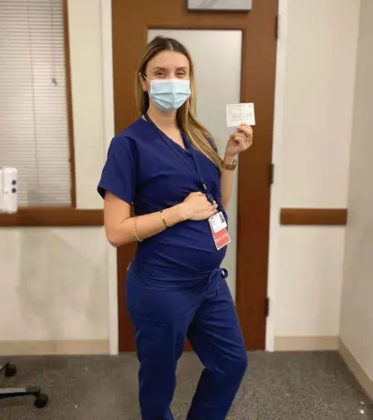  ?? COURTESY OF ST. ELIZABETH’S MEDICAL CENTER; TOP, HERALD STAFF FILE ?? ALL GOOD: Ina Schwartz, an anesthesio­logy resident at St. Elizabeth’s Medical Center, said she was vaccinated for the coronaviru­s after being reassured by her doctor and national recommenda­tions.