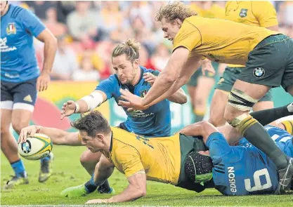  ??  ?? Australia’s Bernard Foley scores a try against Italy in Brisbane.