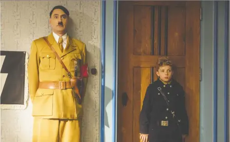  ?? 20TH CENTURY FOX ?? Director Taika Waititi, left, has been in front of the camera recently, including alongside actor Roman Griffin Davis in Jojo Rabbit.