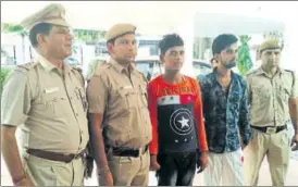  ?? SOURCED ?? Adil (second from right) and Ansari in police custody.