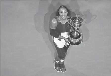  ?? CAMERON SPENCER/GETTY IMAGES ?? Serena Williams won the Australian Open in 2017 while pregnant. Will she be back to defend her title next month?