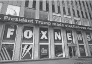  ?? MARK LENNIHAN/AP FILE ?? A headline about President Donald Trump is displayed outside Fox News studios in 2018 in New York. Attorneys for the cable news giant argued in a countercla­im unsealed Thursday that a $1.6 billion defamation lawsuit over the network’s coverage of the 2020 presidenti­al election is an assault on the First Amendment.