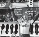  ?? Derik Hamilton, The Associated Press ?? Denny Hamlin celebrates after winning Sunday’s race in Long Pond, Pa.