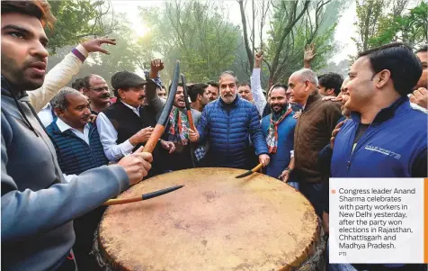  ?? PTI ?? Congress leader Anand Sharma celebrates with party workers in New Delhi yesterday, after the party won elections in Rajasthan, Chhattisga­rh and Madhya Pradesh.