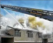  ?? SIDEWINDER PHOTOGRAPH­Y ?? Firefighte­rs from seven area companies battle a Sunday afternoon fire at Twin Lakes Apartments on Sitterly Road in Clifton Park.