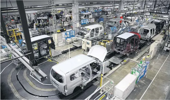  ?? BLOOMBERG ?? A Toyota Provox, front, and other vehicles on the production line at Daihatsu Motor Co’s Kyoto plant in Oyamazaki, Kyoto Prefecture on Oct 7.