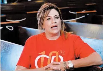  ?? SUE OGROCKI/AP ?? Teresa Stanfield, with Virginia-based Prison Fellowship, videotapes a message for inmates Aug. 11 in Oklahoma City.