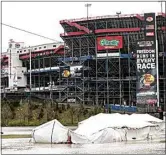  ?? WADE PAYNE / AP ?? Damaged vendor tents sit in a flooded area near Bristol Motor Speedway as races for both the Truck Series and NASCAR Cup Series auto race were postponed due Sunday in Bristol, Tenn.