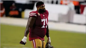  ?? AP PHOTO BY TONY AVELAR ?? San Francisco 49ers offensive tackle Trent Williams (71) walks off the field after the 49ers were defeated by the Philadelph­ia Eagles in an NFL football game in Santa Clara, Calif., in this Sunday, Oct. 4 file photo.