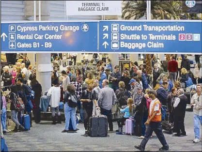  ??  ?? Photo shows the baggage claim area of Terminal 1 at Fort Lauderdale Internatio­nal Airport yesterday, a day after multiple people were shot at the airport.