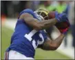  ?? SETH WENIG — THE ASSOCIATED PRESS ?? Giants wide receiver Odell Beckham, catching a pass in last Sunday’s 16-13 win over the Saints, goes up against his nemesis, Redskins cornerback Josh Norman, today in East Rutherford, N.J.