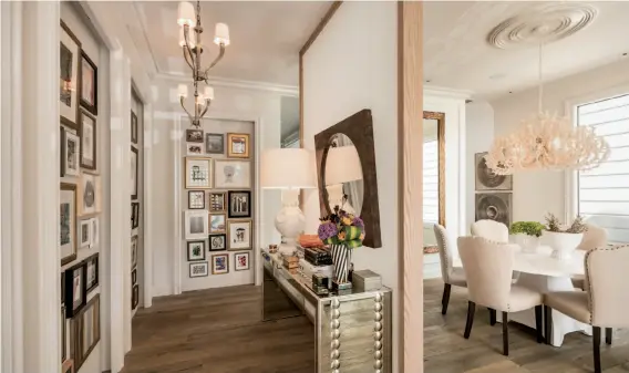  ??  ?? Above: The foyer features four perimeter-lit picture niches to illuminate art displays. Below left: The Castro district home includes a guest suite with wood slat walls and a kitchen. Below right: 143 Collingwoo­d St. is a fully reimagined four-bedroom with a flexible floor plan and large backyard.