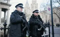  ?? MATT DUNHAM/THE ASSOCIATED PRESS ?? Armed British police officers stand on guard near the French Institute and French School in London the same day a new edition of French magazine Charlie Hebdo went on sale in France.