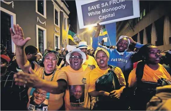  ??  ?? Thrown into relief: Zuma supporters celebrate after yet another vote of no confidence against the president failed in Parliament on Tuesday. Photo: Mike Hutchings/ Reuters