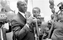  ?? STEVE CANNON/ASSOCIATED PRESS ?? Andrew Gillum holds his son Jackson as he speaks to supporters in Tallahasse­e after he won the Democrat primary for governor Tuesday.