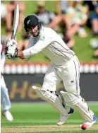  ??  ?? Colin de Grandhomme celebrates his century.