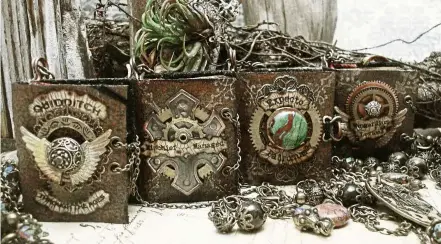  ??  ?? Hogwarts Quartet miniature book necklaces inspired by J.K. Rowling’s Harry Potter book series.