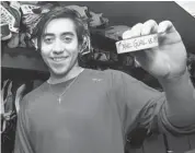  ?? ANDRE RINGUETTE/NHL VIA GETTY IMAGES ?? Mika Zibanejad shows off the puck with which he scored his first career NHL goal.