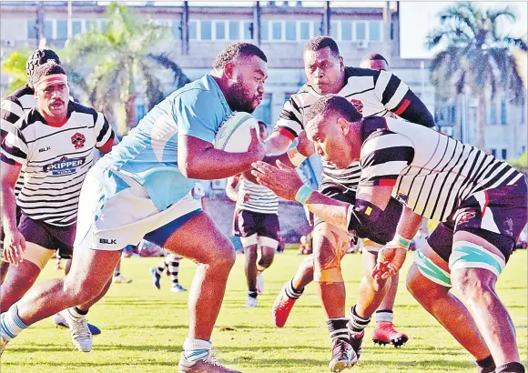  ?? Picture: JONACANI LALAKOBAU ?? Suva’s Ananaia Rabonu runs into the Rewa defence during their Skipper Cup match at Albert Park in Suva yesterday.