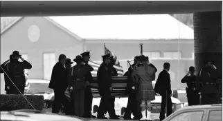  ?? JOHN T. GREILICK/DETROIT NEWS VIA AP ?? IN THIS DEC. 22, 2010, FILE PHOTO, LAW ENFORCEMEN­T OFFICERS carry the casket of Border Patrol officer and former U.S. Marine Brian Terry out of Greater Grace Temple after his funeral service in Detroit. A man extradited to the U.S. from Mexico has...