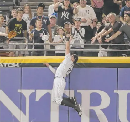  ?? DAVID BANKS/AP ?? Center fielder Adam Engel robs Kyle Higashioka of a home run in the fifth inning. He made a similar play Monday.