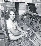  ?? AP ?? Christa McAuliffe tries out the commander’s seat on a shuttle simulator at Johnson Space Center in Houston.