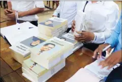  ?? HENG CHIVOAN ?? Books containing the writings of Kem Ley are delivered to the National Library in Phnom Penh yesterday afternoon.