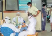  ?? PTI ?? Doctors and patients wear safety masks as a precaution­ary measure after the 'Nipah' virus outbreak in Kozhikode.