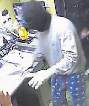  ?? Picture: Kent Police ?? A CCTV image of one of the robbers wearing the pyjamas