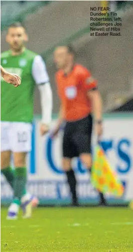  ??  ?? NO FEAR: Dundee’s Fin Robertson, left, challenges Joe Newell of Hibs at Easter Road.