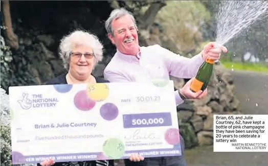  ?? MARTIN BENNETT/THE NATIONAL LOTTERY ?? Brian, 65, and Julie Courtney, 62, have kept a bottle of pink champagne they have been saving for 20 years to celebrate a lottery win