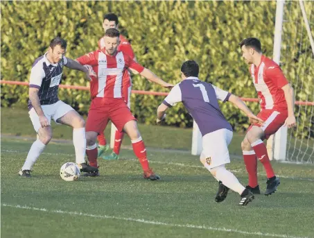  ??  ?? Seaham Red Star (red/white) in action against Ryhope CW at Seaham Town Park, on Saturday.