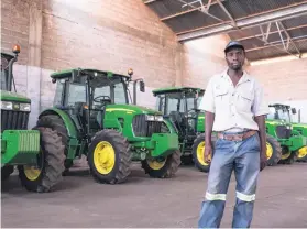  ??  ?? ROARING TO GO. Production manager Ben Takalo with new tractors.