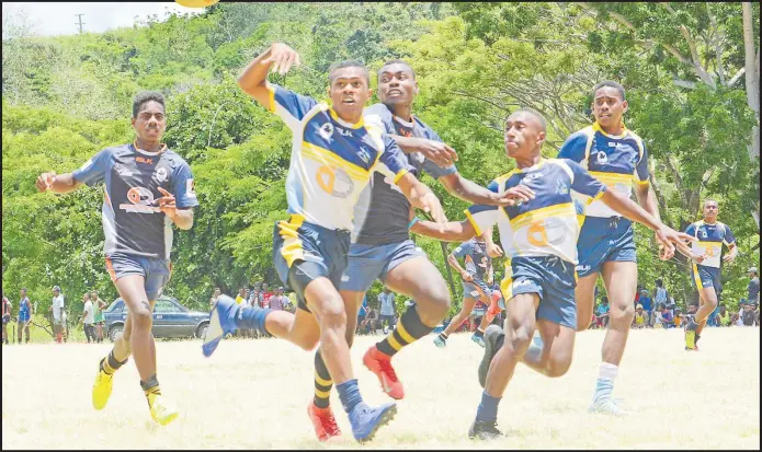  ?? Picture: SOPHIE RALULU/ FILE ?? Ratu Filise under-17 player Ratu Meli Nakasavu flicks a pass during the Nadroga 7s tournament at the Kalevu grounds in Nadroga last year.