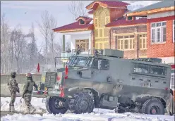  ?? PTI ?? Army personnel outside the house in south Kashmir’s Kulgam district where the militants were hiding. The house was cordoned off by security forces before the gun battle.