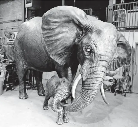  ?? [PHOTO
BY STEVE SISNEY, THE OKLAHOMAN] ?? Artist Jocelyn Russell’s lifesize elephant sculptures are seen at The Crucible on April 20 in Norman.