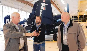  ?? ANDRES LEIGHTON/FOR THE JOURNAL ?? Rex Corbin of the 58th Operations Group at Kirtland Air Force Base, left, Ireke Cooper, president of Cooper Fire Protection Services, center, and Jay Laughlin, head of operations and chief nuclear officer at URENCO USA, attend a Leadership New Mexico tour of the War Eagles Museum in Santa Teresa in January.