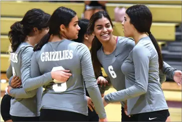  ?? RECORDER PHOTO BY CHIEKO HARA ?? Granite Hills High School’s volleyball team celebrates Tuesday, Aug. 21, after winning the first set over Wonderful College Prep Academy at Granite Hills High School.