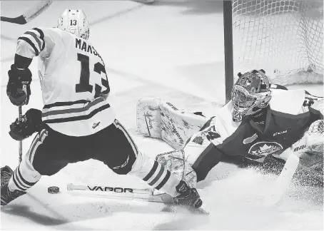  ?? DAN JANISSE ?? The Niagara IceDogs’ Kirill Maksimov is stoned by Spitfires goalie Mikey DiPietro Sunday during a 2-0 win for the hosts in Windsor.