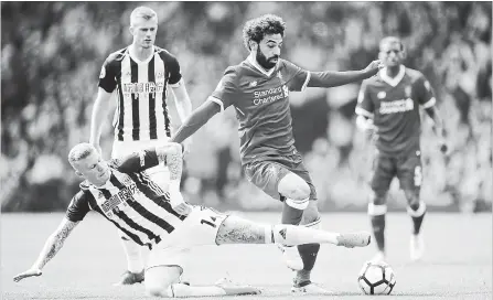  ?? GETTY IMAGES FILE PHOTO ?? Mohamed Salah of Liverpool is tackled by James McClean of West Bromwich Albion during the Premier League match earlier this month.