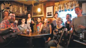  ?? Rachel Smith / Contribute­d photo ?? The cast of “Once” enjoys a beer and rehearsal in the Ivoryton Tavern.